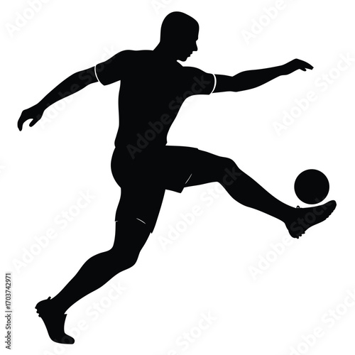 Silhouette of Football Player Kicking a Soccer Ball with Dynamic Action Stance