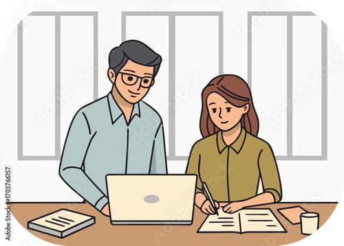 Man and Woman Working Together at a Desk with a Laptop and Books collaboration teamwork