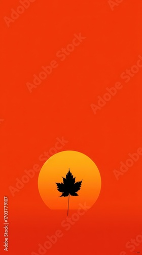 Autumnal Silhouette - Maple Leaf Against a Setting Sun in Vivid Orange.