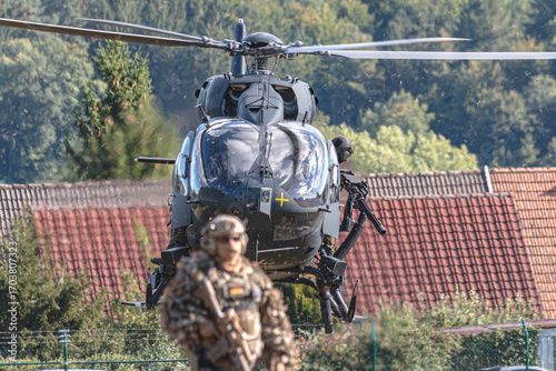 A German Bundeswehr Airbus H145 combat helicopter flies during a NATO exercise, showcasing modern military aviation, strength, and readiness for tactical operations in international defense.