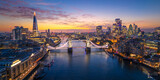 London City Skyline with Tower Bridge Illuminated at Sunset Aerial Panorama, England, United Kingdom