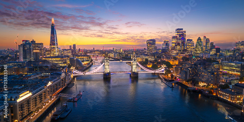 London City Skyline with Tower Bridge Illuminated at Sunset Aerial Panorama, England, United Kingdom