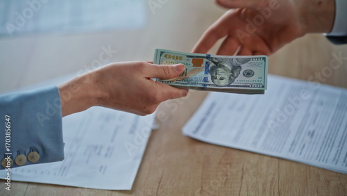 People hands exchanging money bribery at office closeup. Corporate corruption
