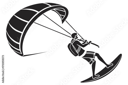 Kitesurfer riding a board with a large kite
