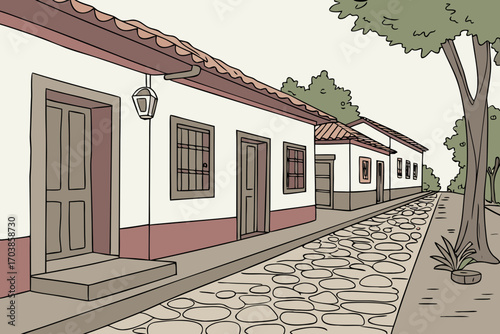 Charming cobblestone street lined with white houses and trees