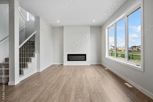 Wallpaper Mural Large open living room with a fireplace and a window Torontodigital.ca