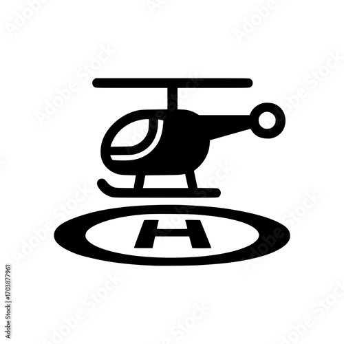 Sleek helicopter landing on a helipad, symbolizing modern transportation and aerial access.