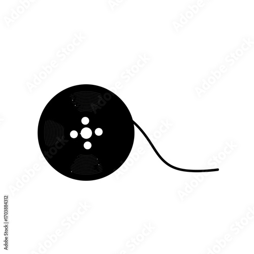 Black film reel with strand of film unspooling