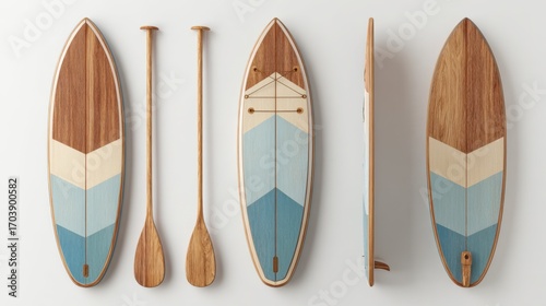 Wooden paddleboards  paddles arranged on a white surface showing intricate grain patterns and color blocking