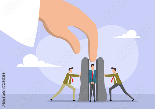 A businessman stands between two large, gray