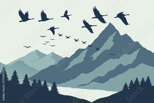 Silhouettes of migrating birds flying over mountains at sunset