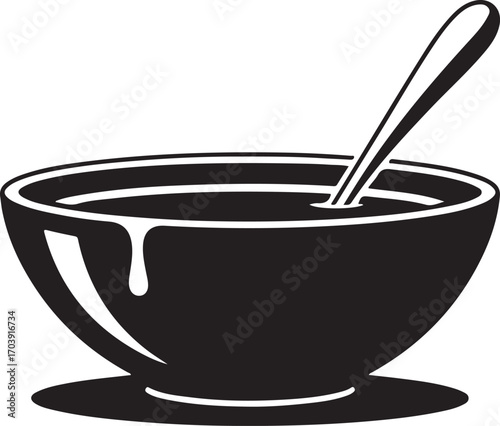 Simple black bowl filled with dark red liquid and spoon