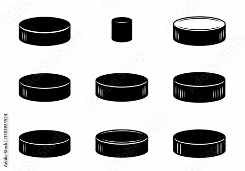 Set of black hockey pucks and cylindrical shapes, presented as graphic icons on a white background, in various orientations and views.