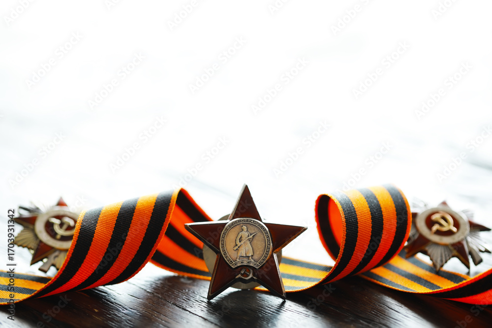 Naklejka premium Patriotic War Order and battle order for courage and bravery on George Ribbon background for the great day of Victory (russian text: Patriotic War)