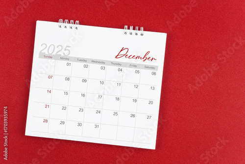 Wallpaper Mural December 2025 desk calendar on red background. Page of annual monthly calendar for plan. Torontodigital.ca