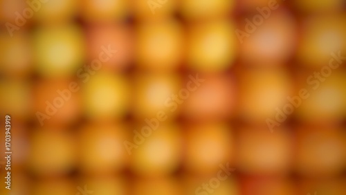 The image is a soft-focus, abstract shot dominated by a grid-like pattern of blurred, circular shapes.