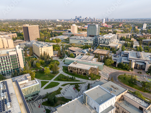 Aerial view of the University of Calgary campus with the city skyline in the distance. 