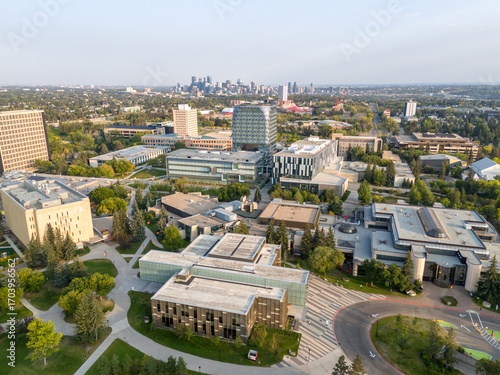 Aerial view of the University of Calgary campus with the city skyline in the distance. 