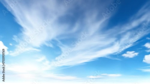 A vibrant, clear blue sky dotted with fluffy white clouds