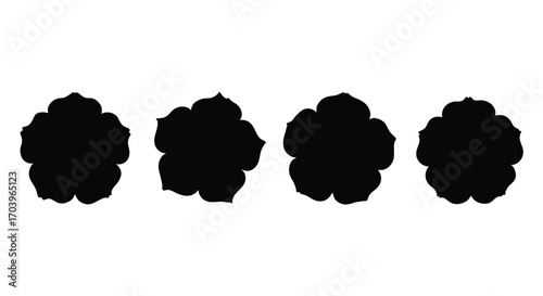 Four black silhouetted flower shapes with petals scattered art elements vector