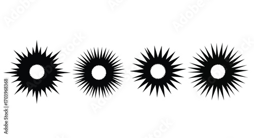 Four abstract starburst shapes with sharp spikes radiating from a central circle vector