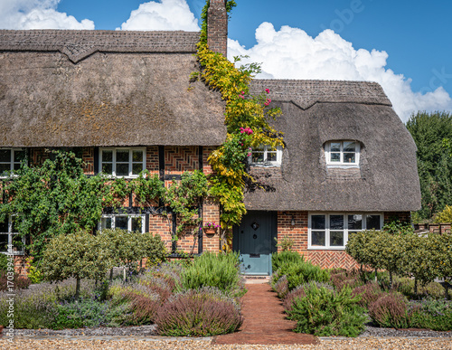 Traditional English village with thatched cottages.