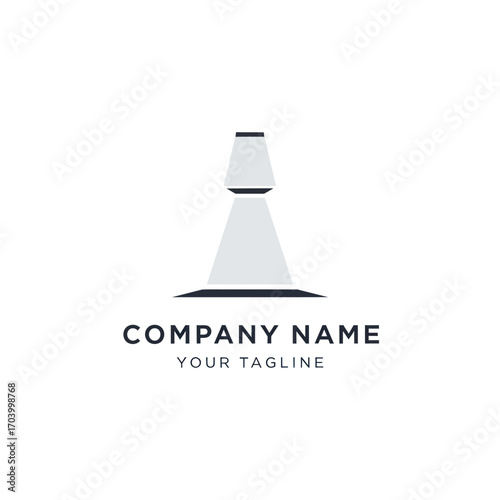 Minimalist logo design featuring a stylized spotlight illuminating a dark base, representing illumination and brand identity.