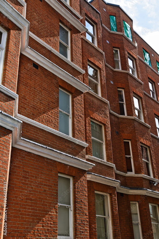 Obraz premium Brick Buildings with White Trim and Windows in London, UK.