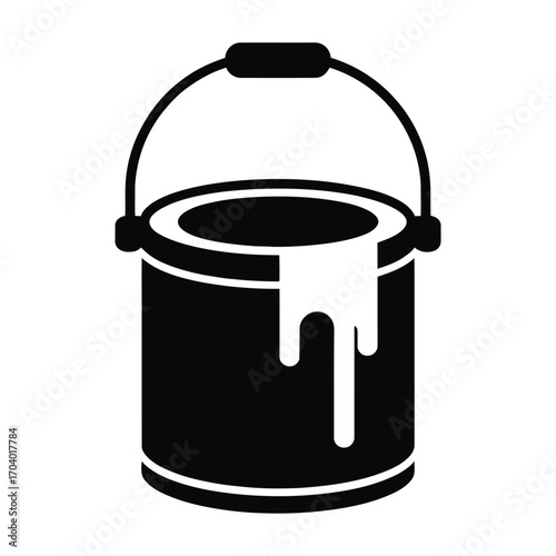 Black paint can with white paint dripping over the side