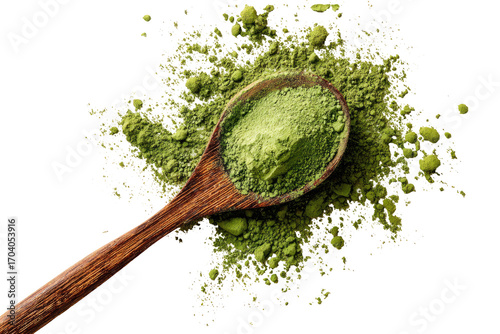Wooden spoon filled with vibrant green matcha powder, scattered around