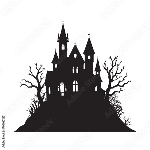 Spooky silhouette of a haunted castle on a hill with bare trees