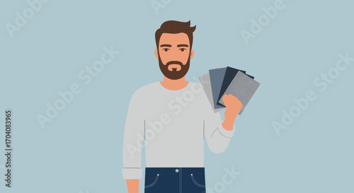 Young man holding fabric swatches in hand, casual outfit and approachable demeanor