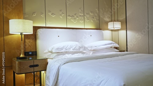 Interior bedroom with bed and nightstand, slow motion video