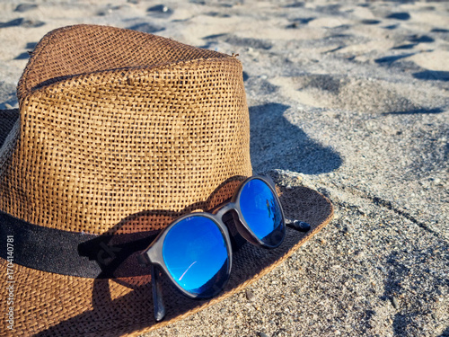 Travel, vacation, a hat and sunglasses on the beach