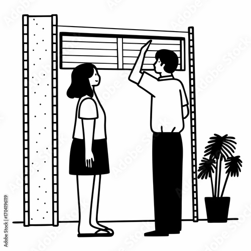 A man and a woman stand next to a tall vertical structure with horizontal blinds and a potted plant suggesting a modern interior or architectural design concept