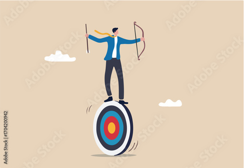 Purpose driven, motivation to reach goal and success, mission to achieve target or business strategy to drive success concept, ambitious businessman archery holding arrow and bow balance on target