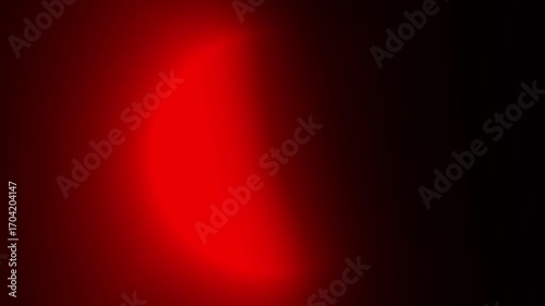 Abstract red glowing crescent light on dark background with smooth futuristic neon rotating effect