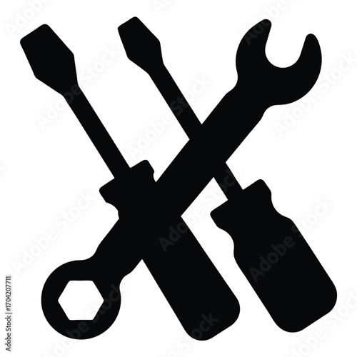 Black silhouette of a wrench and two screwdrivers on white background