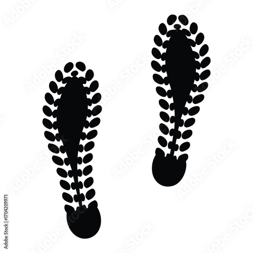 Two footprints with a unique tread pattern left on a white surface