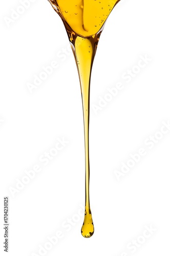 Rich golden liquid honey slowly dripping and flowing in a thin stream with a single drop suspended in air, creating a beautiful viscous texture