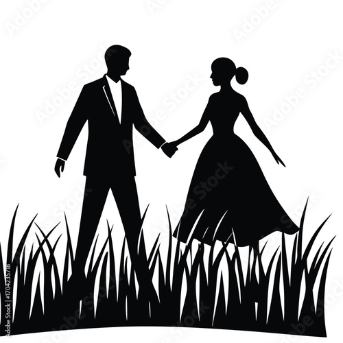 Wedding couple silhouetted in tall grass holding hands love romance