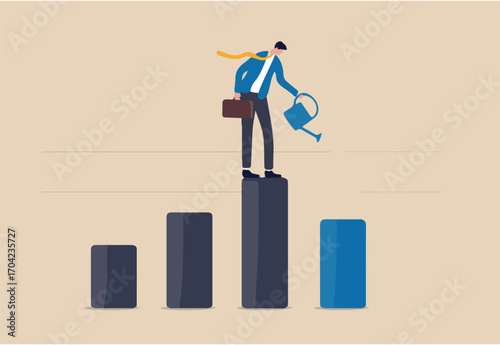 Economic recover from money stimulus, leadership to grow business, investment growth or profit and earning concept, businessman leader standing on profit bar graph watering this year growing bar chart