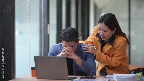 Supportive businesswoman consoling anxious coworker, displaying professional compassion during stressful office interaction