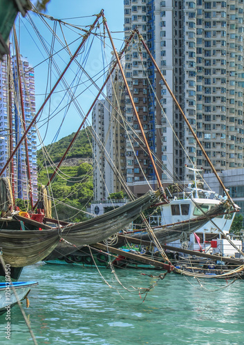Boats and condos in Aberdeen Fishing Village, Hong Kong harbor, China