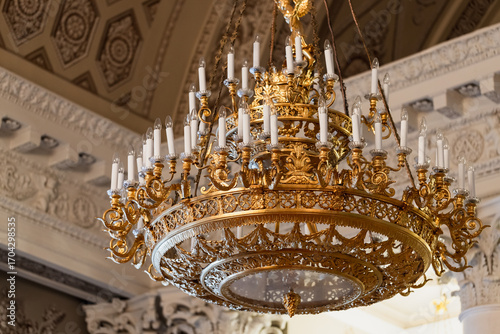 Wallpaper Mural A luxurious golden chandelier adorned with intricate details Torontodigital.ca