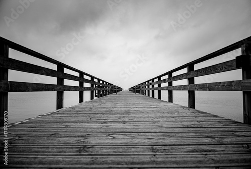 Black and White Pier with Leading Lines to the Horizon