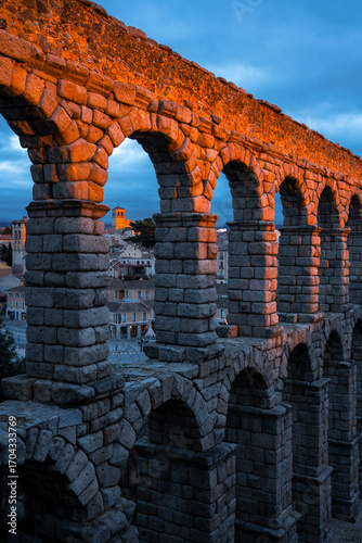 Roman aqueduct of Segovia at sunset, Spain