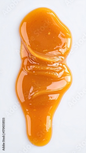 Caramel sauce drizzled on a white background