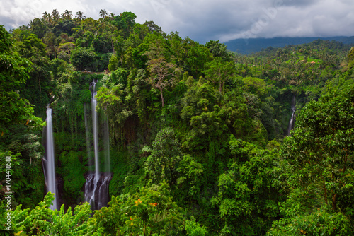 Stunning view of Sekumpul waterfall surrounded by lush jungle, Bali, Indonesia