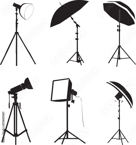 Photo studio setup with a camera, a tripod, and lighting equipment